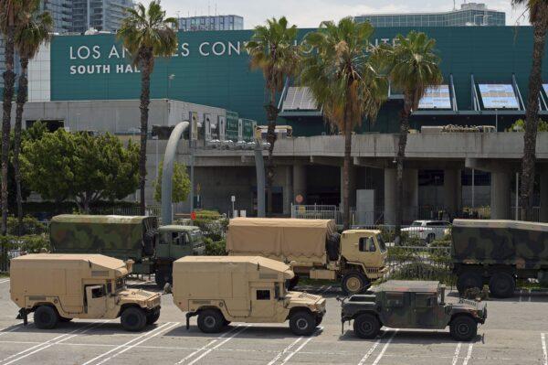 California National Guard vehicles are seen parked at the Los Angeles Convention Center after demonstrators protested the death of George Floyd in Los Angeles, Calif., on May 31, 2020. (Agustin Paullier/AFP via Getty Images)
