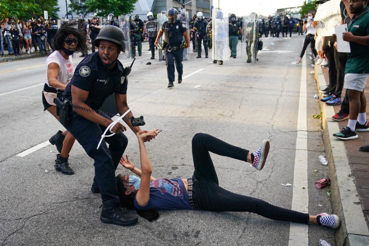 Police detain demonstrators for being in the street during a protest in Atlanta, Ga., on May 30, 2020. (Elijah Nouvelage/Getty Images)