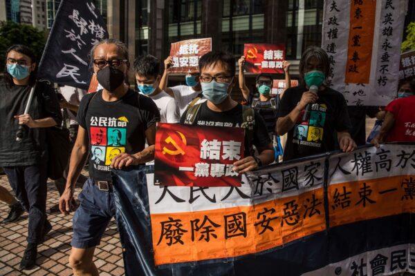 Pro-democracy protesters march during a rally against a new national security law in Hong Kong on July 1, 2020. (Dale de la Rey/AFP via Getty Images)