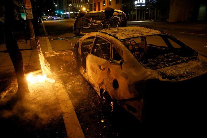 Destroyed vehicles amid nationwide unrest following the death in Minneapolis police custody of George Floyd, in Washington on June 1, 2020. (Jim Bourg/Reuters)