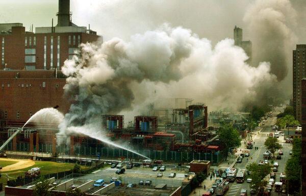 Firefighters attempt to extinguish a fire at a power plant on 13th Street in New York on July 20, 2002. (Mario Tama/Getty Images)