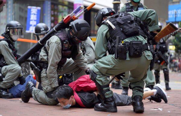 Riot police detain a protester during a demonstration against Beijing's national security legislation in Causeway Bay in Hong Kong on May 24, 2020. (AP Photo/Vincent Yu)