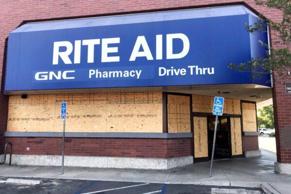 A pharmacy's windows are boarded up in Santa Ana, Calif., on June 1, 2020. (Chris Karr/The Epoch Times)