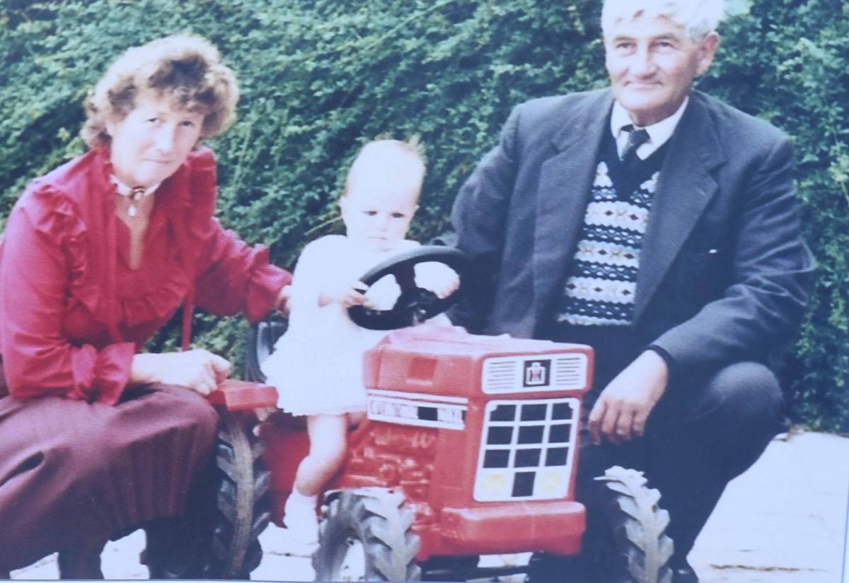 Joan Bomford with husband, Tony, and grandchild in Evesham, Worcestershire. (Caters News)