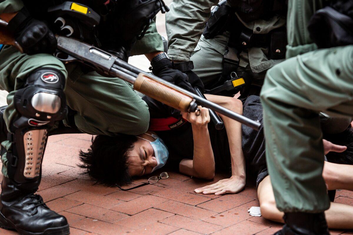 Pro-democracy protesters are arrested by police in the Causeway Bay district of Hong Kong on May 24, 2020. (Isaac Lawrence/AFP via Getty Images)