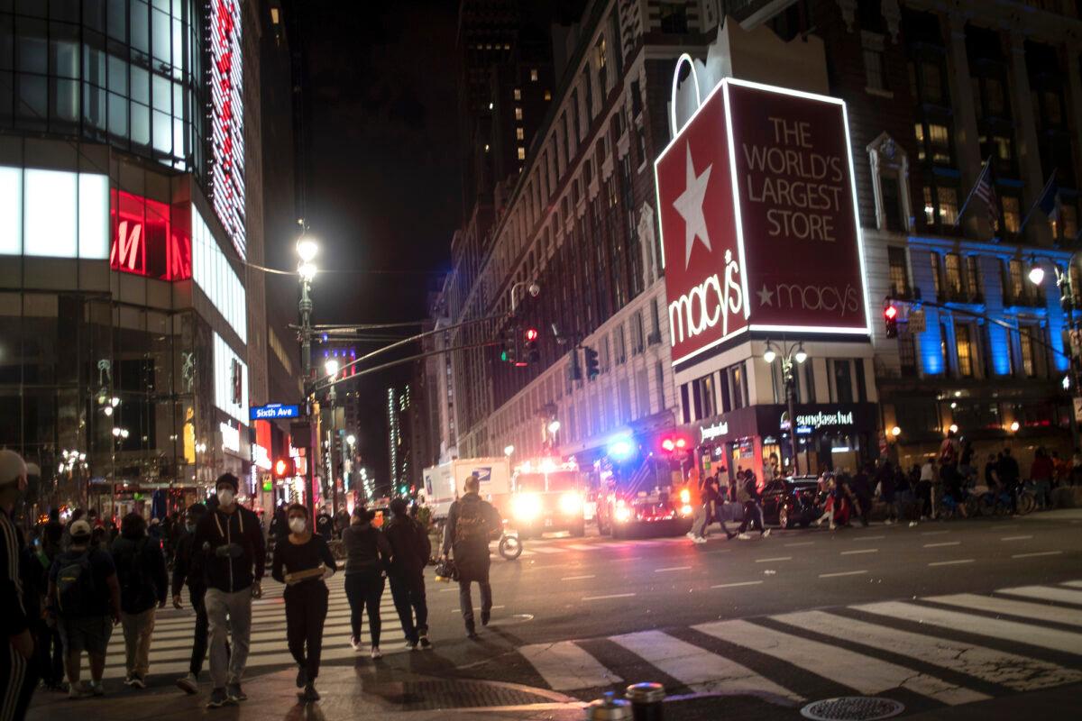 Police vehicles park outside Macy’s flagship Herald Square store in New York city after it was broken into on June 1, 2020. (Wong Maye-E/AP Photo)