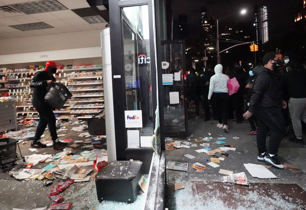 People loot a store during demonstrations over the death of George Floyd by a Minneapolis police officer, in New York on June 1, 2020. (Bryan R. Smith/AFP via Getty Images)