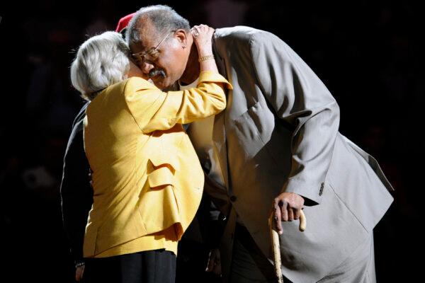 Former Washington Bullets basketball player and Hall of Famer Wes Unseld (R) is greeted by Irene Pollin (L) wife of the late Bullets' owner Abe Pollin, during a ceremony to celebrate the 35th anniversary of the Bullets only NBA championship, during halftime of an NBA basketball game between the Washington Wizards and the Indiana Pacers, in Washington, on April 6, 2013. (Nick Wass/AP Photo)