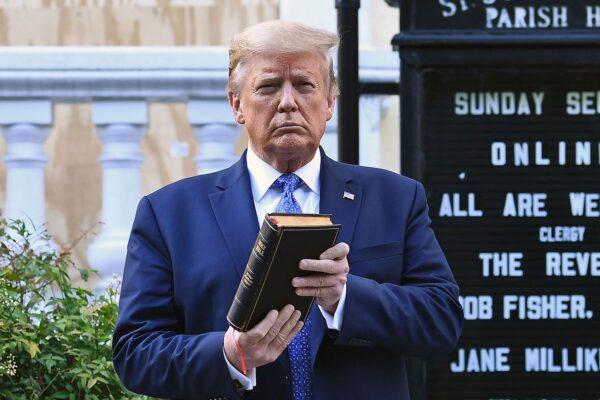  President Donald Trump holds up a Bible outside of St John's Episcopal Church across Lafayette Park in Washington, on June 1, 2020. (Brendan Smialowski/AFP via Getty Images)