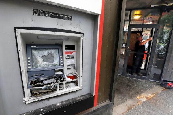 A damaged ATM machine outside a KeyBank branch in downtown Pittsburgh on Sunday, May 31, 2020. (Gene J. Puskar/AP)