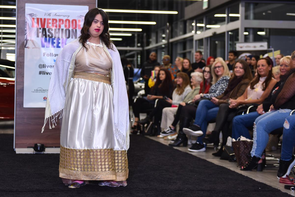 Kirsty Harrower, 18, on the catwalk during her first-ever runway walk at Liverpool Fashion week on Oct. 8, 2019. (Caters News)