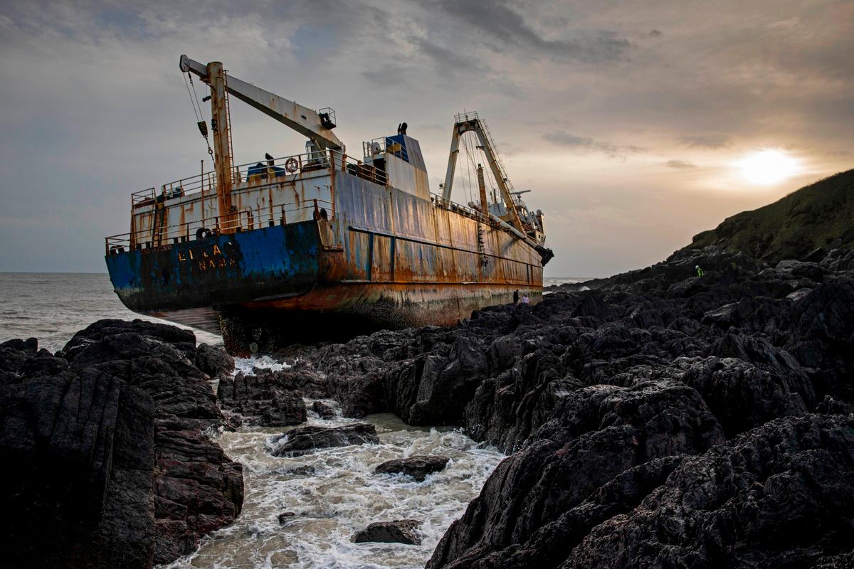 The abandoned 77-meter-long (250-foot) "ghost ship" MV Alta is pictured stuck on rocks near the village of Ballycotton southeast of Cork in Southern Ireland on Feb. 18, 2020. (CATHAL NOONAN/AFP via Getty Images)