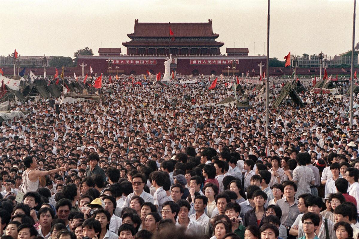 Hundreds of thousands of Chinese gather in Tiananmen Square around a 10-meter replica of the Statue of Liberty (C), called the Goddess of Democracy, demanding democracy despite martial law in Beijing, on June 2, 1989. Hundreds, possibly thousands, of protesters were killed by China's military on June 3 and 4, 1989, as communist leaders ordered an end to six weeks of unprecedented democracy protests in the heart of the Chinese capital. (Catherine Henriette/AFP via Getty Images)