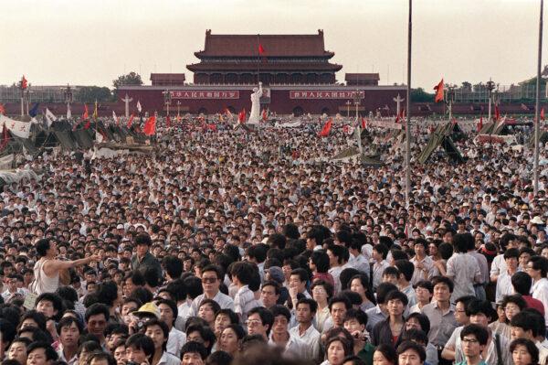 Hundreds of thousands of Chinese gather in Tiananmen Square around a 10-meter replica of the Statue of Liberty (C), called the Goddess of Democracy, on June 2, 1989. (Catherine Henriette/AFP via Getty Images)