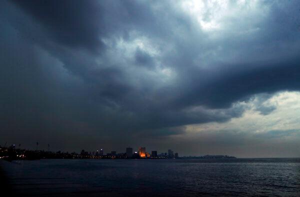 Dark clouds hang over the city ahead of cyclone Nisarga making landfall in Mumbai, India, on June 2, 2020. (Rajanish Kakade/AP Photo)