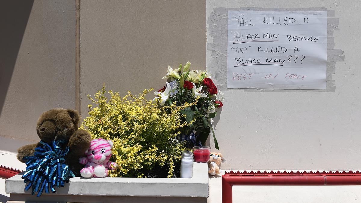 Flowers and messages are left at a memorial for David Dorn, a 77-year-old retired police captain who was murdered during overnight rioting outside Lee's Pawn and Jewelry, on June 2, 2020 in St Louis, Mo. (Michael B. Thomas/Getty Images)