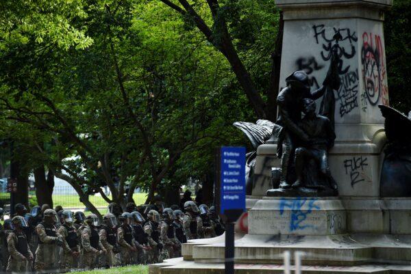 Police hold a perimeter at Lafayette Square near the White House as demonstrators gather to protest the killing of George Floyd in Washington, on June 2, 2020. (Olivier Douliery/AFP/Getty Images)