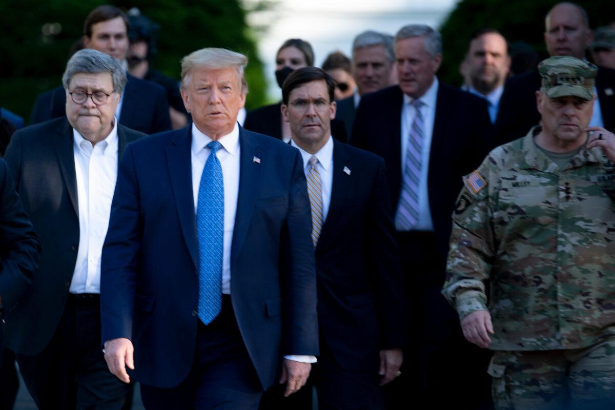 President Donald Trump walks with Attorney General William Barr, left, Secretary of Defense Mark Esper, center, Chairman of the Joint Chiefs of Staff Mark Milley, right, and others from the White House to visit St. John's Church in Washington on June 1, 2020. (Brendan Smialowski/AFP via Getty Images)