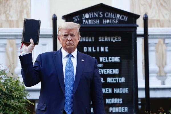 President Donald Trump holds a Bible as he visits outside St. John's Church across Lafayette Park from the White House, in Washington, on June 1, 2020. (Patrick Semansky/AP Photo)