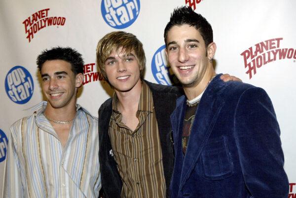 Actor Frankie Galasso (L), singer Jesse McCartney, and singer Greg Raposo (R) pose at Popstar! Magazine's album release party for McCartney's new CD "Beautiful Soul" on Sept. 17, 2004 at Planet Hollywood in New York City. (Photo by Paul Hawthorne/Getty Images)
