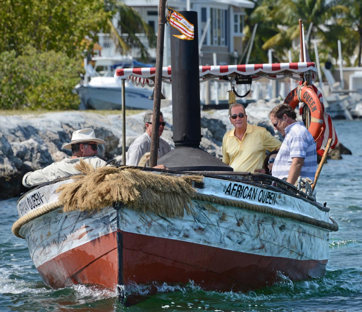 <span class="s1">The African Queen, the original vessel from director John Huston’s classic 1951 film by the same name, sails on a Key Largo, Fla., canal, in this file photo. Built in 1912, the 30-foot boat that carried Humphrey Bogart and Katharine Hepburn has been refurbished to provide Florida Keys visitors an opportunity to ride the cinema icon</span>. (Andy Newman/Florida Keys News Bureau/HO)