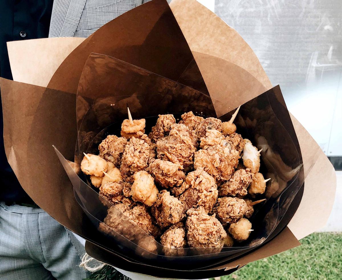 Lucy Zhao's KFC bouquet that her boyfriend, Gabriel You, made for her (Caters News)