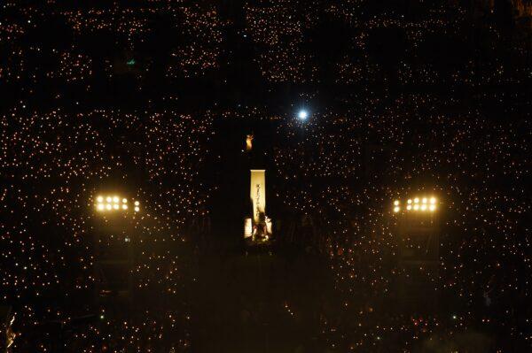 Participants hold candles as the Goddess of Democracy statue (C) is seen at Hong Kong's Victoria Park on June 4, 2017, during a candlelight vigil to mark the 28th anniversary of the 1989 Tiananmen clampdown in Beijing. (Anthony Wallace/AFP via Getty Images)