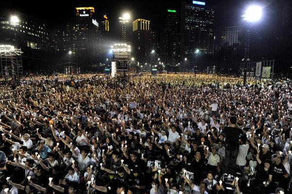 Thousands of people take part in a candlelight vigil in Victoria Park in Hong Kong on June 4, 2009, to mark the 20th anniversary of Beijing's crackdown on pro-democracy protesters in Tiananmen Square. (ANTONY DICKSON/AFP via Getty Images)