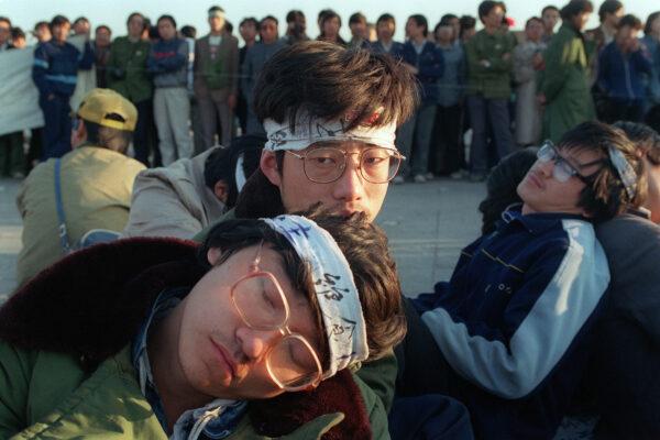 Student hunger strikers from Beijing University relax as several hundred students start an unlimited hunger strike as the part of mass pro-democracy protest against the Chinese government at Tiananmen Square on May 14, 1989. (Catherine Henriette/AFP via Getty Images)