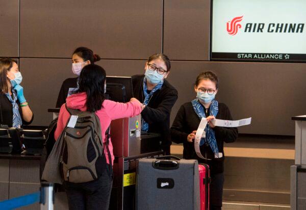 Chinese citizens check in to their Air China flight to Beijing, at Los Angeles International Airport, on Feb. 2, 2020. (Mark Ralston/AFP via Getty Images)