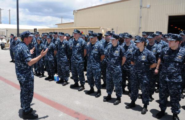 Capt. George Norman, the commanding officer of the blue crew of the guided-missile submarine USS Ohio (SSGN 726), addresses his command as the gold crew pulls the ship into Apra Harbor, Guam. (U.S. Navy photo by Mass Communication Specialist 1st Class Jeffrey Jay Price)