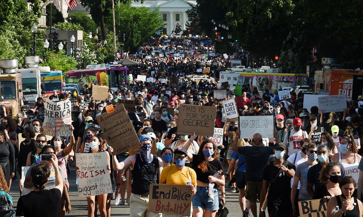 Protesters march during a demonstration against racism and police brutality near the White House in Washington on June 6, 2020. (Olivier Douliery/ AFP)
