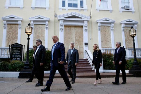 President Donald Trump, accompanied by senior aides, departs after visiting outside St. John's Church across Lafayette Park from the White House, in Washington, on June 1, 2020. (AP Photo/Patrick Semansky)