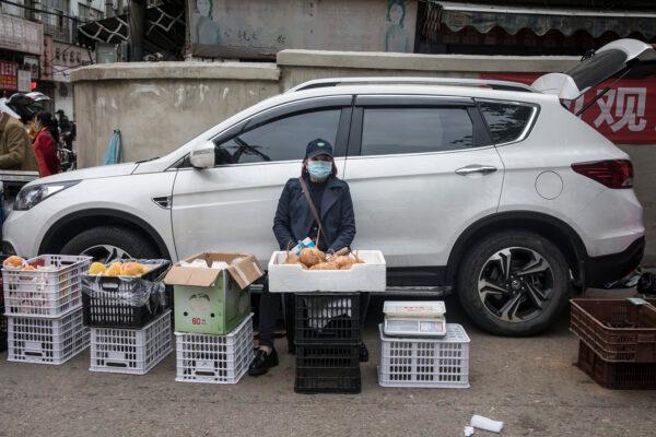 A vendor is selling fruits on a street in Wuhan, China on April 23, 2020. (Getty Images)