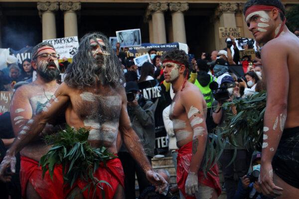 Aboriginal protesters conduct a traditional smoking ceremony at Town Hall during a protest march, Sydney, Australia, June 06, 2020. (Lisa Maree Williams/Getty Images)