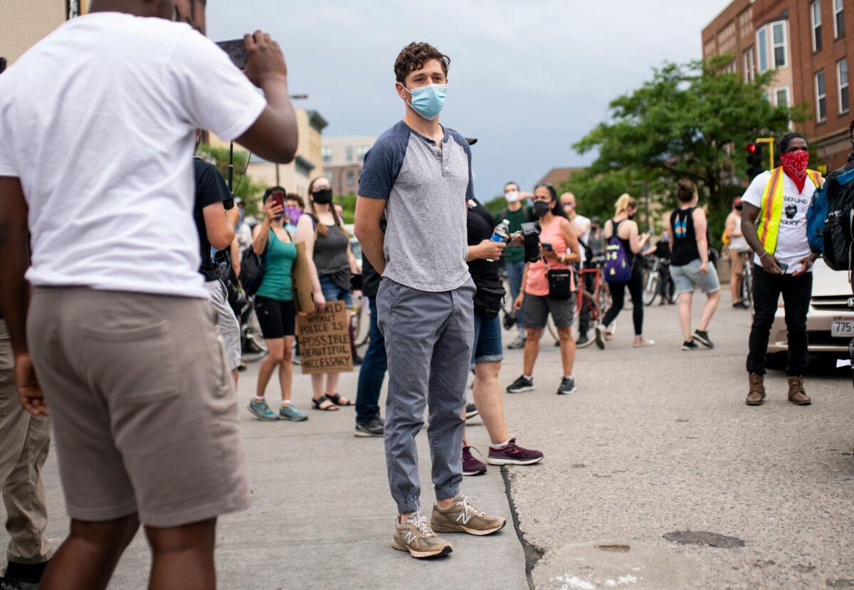 Minneapolis Mayor Jacob Frey looks over a demonstration calling for the Minneapolis Police Department to be defunded in Minneapolis, Minn., on June 6, 2020. (Stephen Maturen/Getty Images)