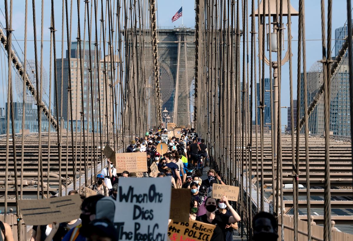 Protesters and activists walk across the Brooklyn Bridge in New York City on June 6, 2020. (Craig Ruttle/AP Photo)