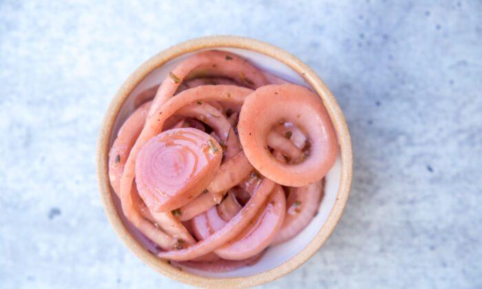 If possible, make the marinated onions the night before: they'll get tangier (and pinker!) over time. (Caroline Chambers)