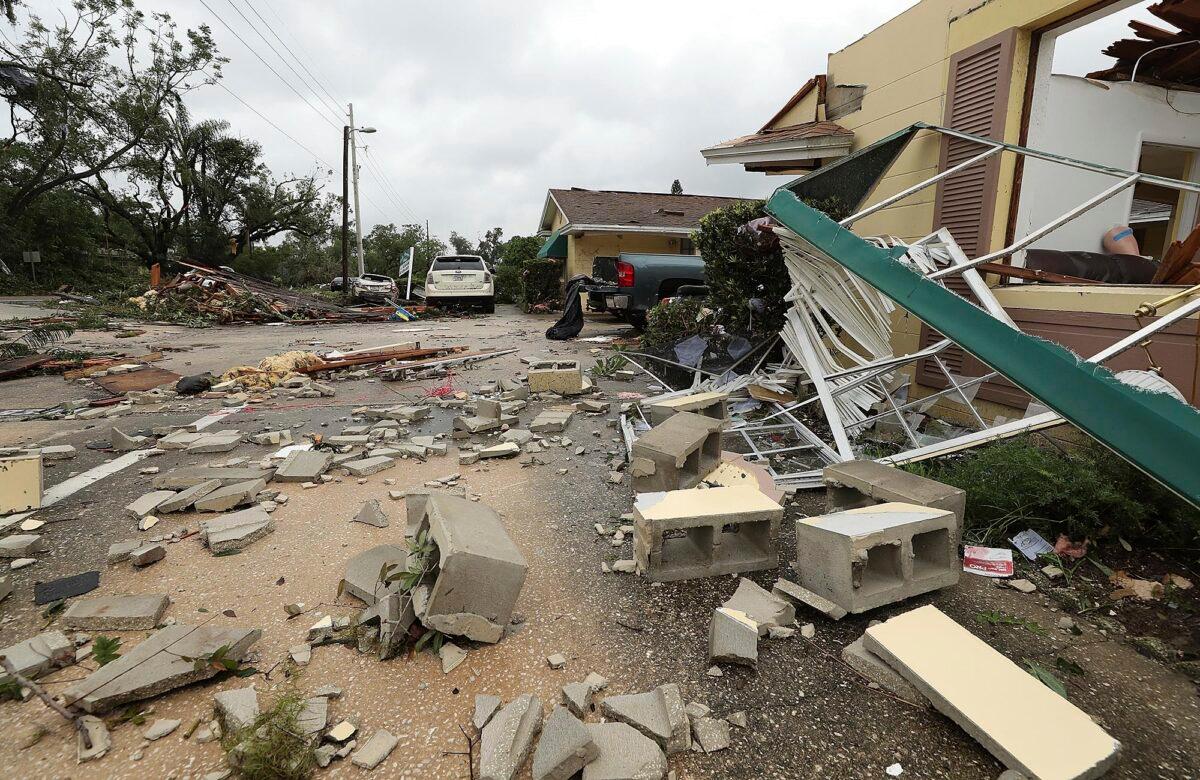 Debris is strewn on the ground at Lake Margaret Village Apartments following a tornado the day before in Orlando, Fla., on June 7, 2020. (Stephen M. Dowell/Orlando Sentinel via AP)