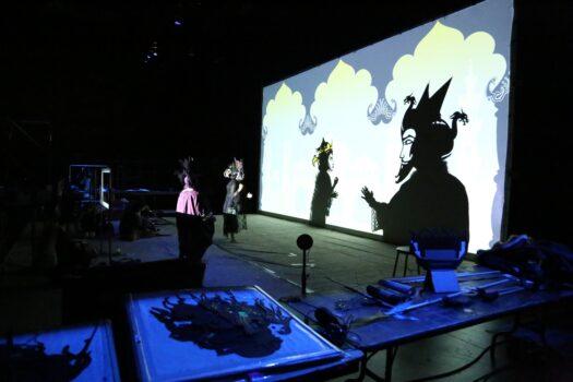 A backstage look at the production, showing a live actor performing. (Fictionville Studio)
