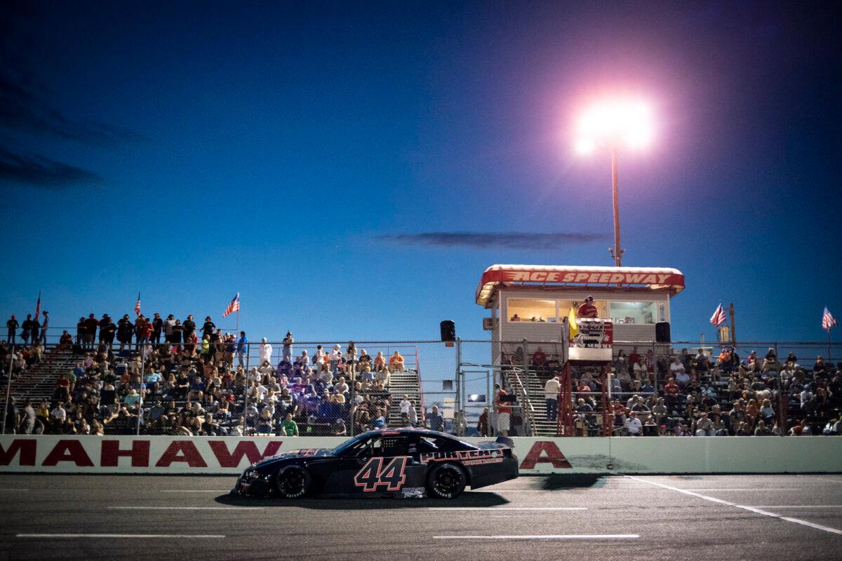 A race car passes the stands at the Ace Speedway in Altamahaw, N.C., on May 30, 2020. (Al Drago/Getty Images)