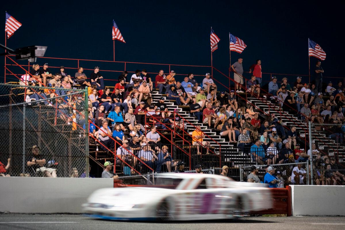 A race car passes stands at the Ace Speedway in Altamahaw, N.C., on May 30, 2020. (Al Drago/Getty Images)