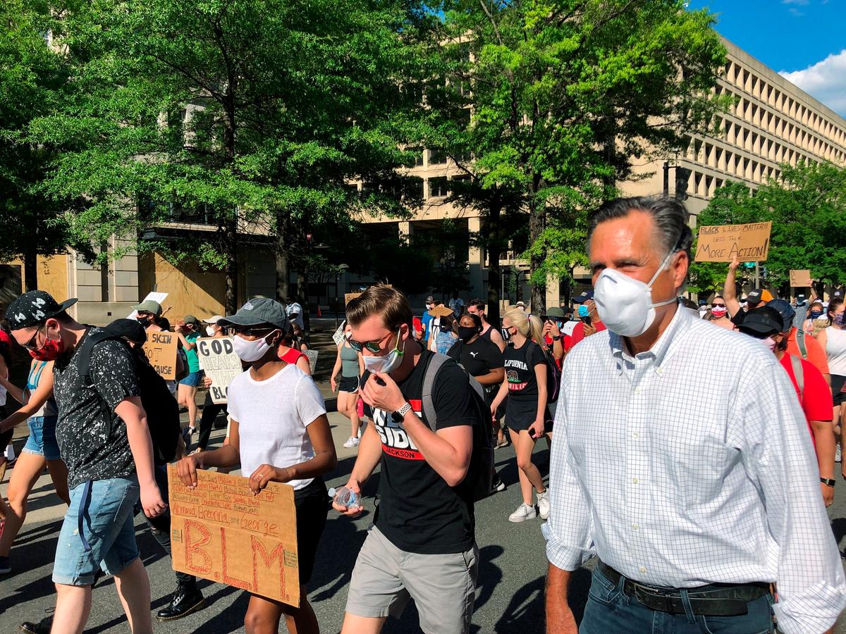 Sen. Mitt Romney Walks With Protesters in Washington