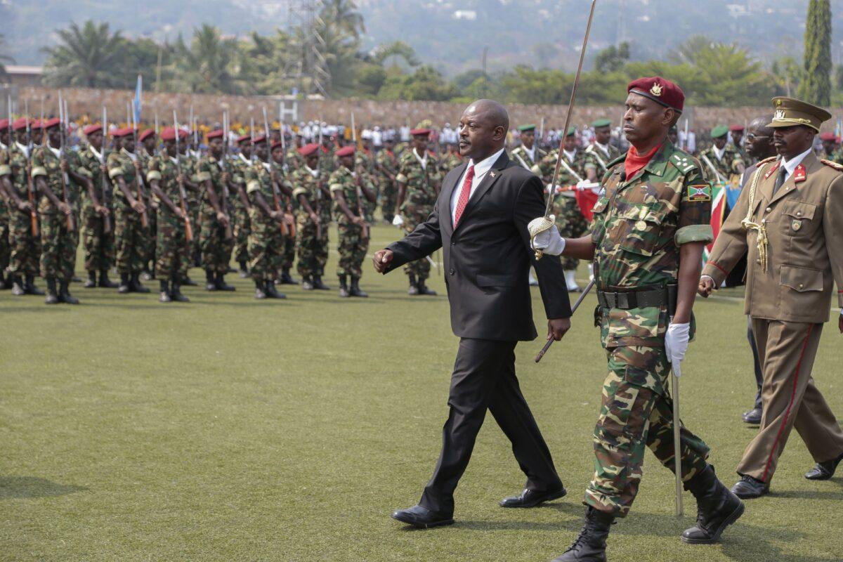 Burundi's President Pierre Nkurunziza (C) walks to inspect a guard of honor in Bujumbura, Burundi, on July 1, 2015. (Berthier Mugiraneza/AP Photo)
