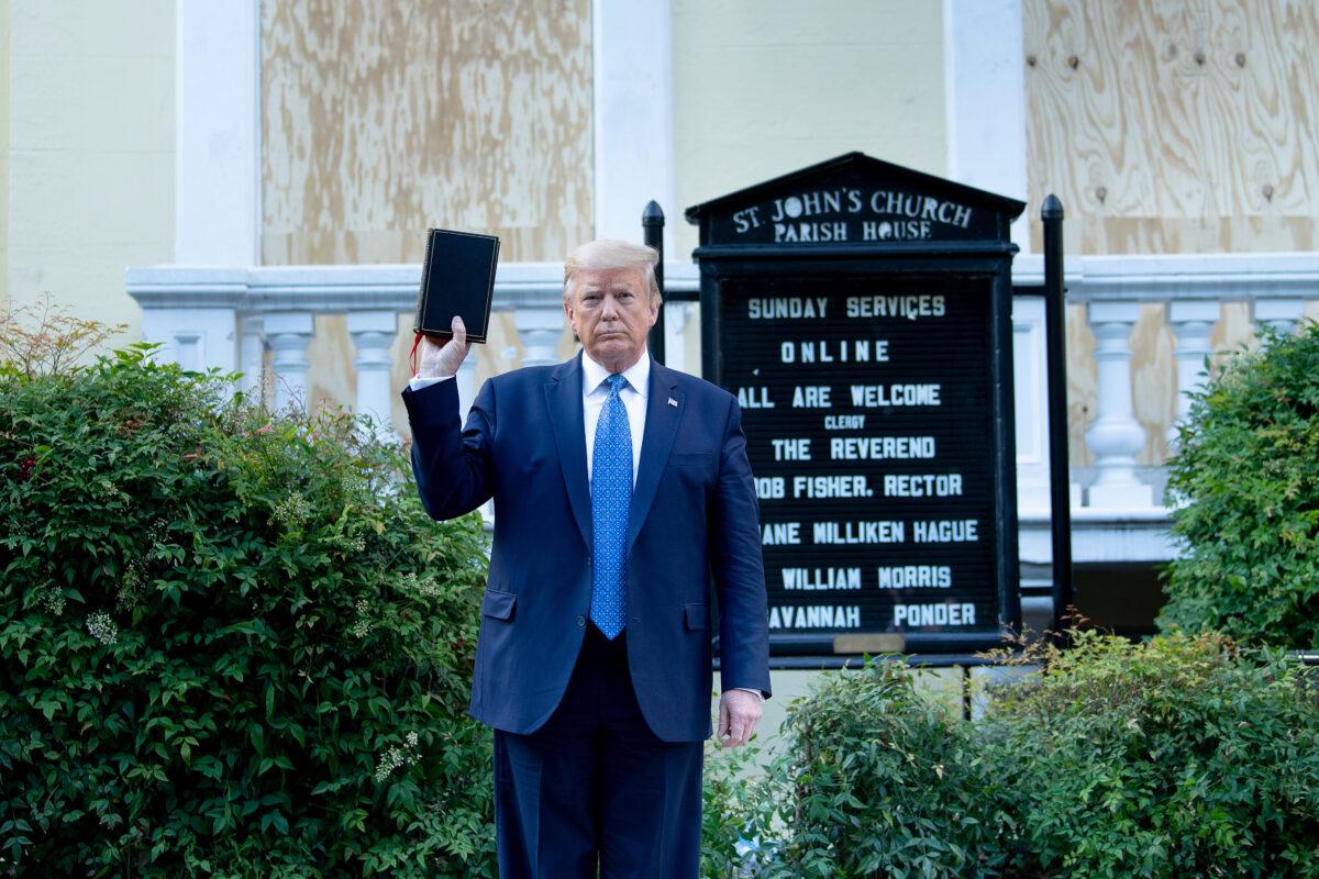 President Donald Trump holds a family Bible while visiting St. John's Church across from the White House in Washington on June 1, 2020. (Brendan Smialowski/AFP/Getty Images)