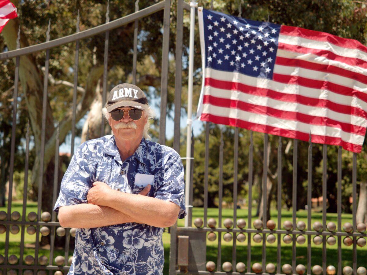 Vietnam War veteran Robert Rosebrock stands in front of the Veteran Affairs Greater Los Angeles Healthcare System campus to protest uses of the campus he says does not serve veterans, on June 7, 2020. (Hau Nguyen/The Epoch Times)