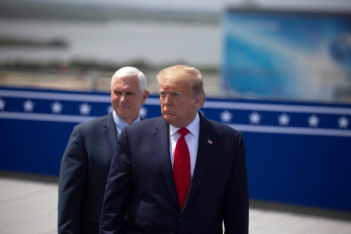 Vice President Mike Pence, left, President Donald Trump wait on the rooftop of the Operational Building at NASA before the launch of the SpaceX Falcon 9 rocket with NASA astronauts aboard the rocket from the Kennedy Space Center in Cape Canaveral, Fla. on May 30, 2020. (Saul Martinez/Getty Images)