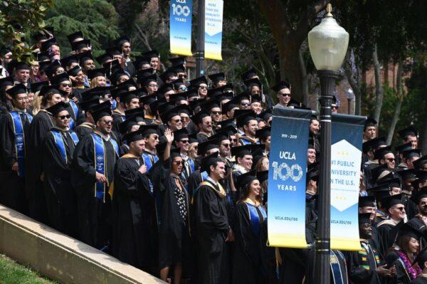 Graduating students pose for a class picture at the University of California Los Angeles (UCLA), in Los Angeles, Calif., on June 14, 2019. (Robyn Beck/AFP via Getty Images)