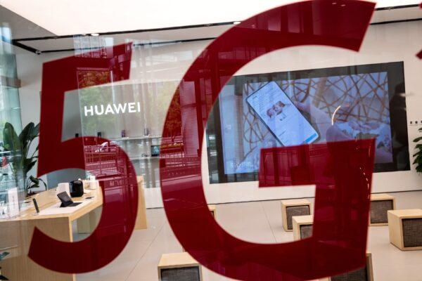 A Huawei shop features a red sticker reading “5G” in Beijing on May 25, 2020. (Nicolas Asfouri/AFP via Getty Images)