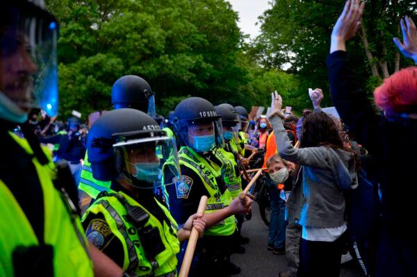 Protesters confront a row of police officers at a demonstration in Franklin Park in Boston, Mass., on June 2, 2020. (Joseph Prezioso/AFP via Getty Images)